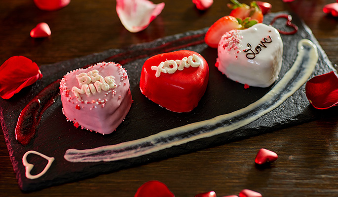 Valentine's Cake Trio following the form of traditional candy hearts.